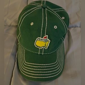 Lot of various hats. Masters, Aston Martin, Nike, Datsun